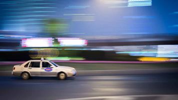 A taxi rushes by in Shanghai