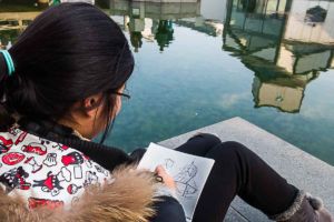 Photographing a sketch and the artist as subject.