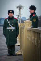 Two guards... well, standing guard, over a cold winter's day in Beijing.